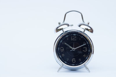 Close-up of clock against white background