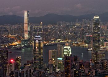 Aerial view of city lit up at night