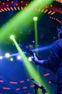 Low angle view of man playing guitar