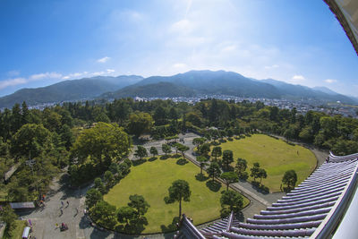 High angle view of trees and mountains against sky