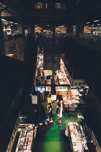 High angle view of illuminated market in city at night