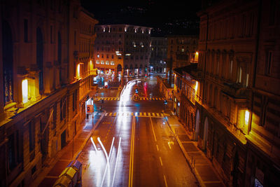 Illuminated light trails on road at night