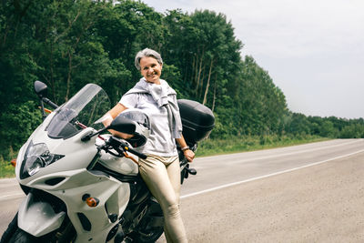 Man riding motorcycle on road