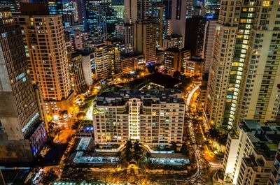 High angle view of illuminated buildings in city