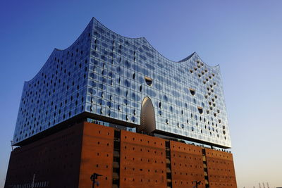 Low angle view of buildings against blue sky