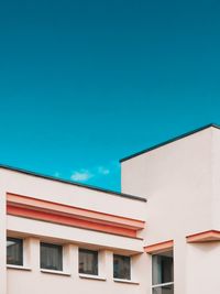 Low angle view of building against blue sky