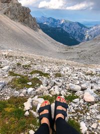 Low section of woman on rock