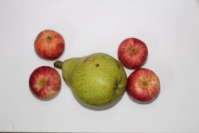 Close-up of fruits over white background