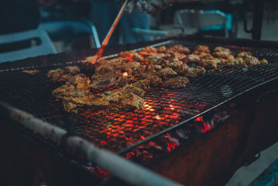 Close-up of meat on barbecue grill