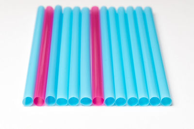 Close-up of colorful colored pencils over white background