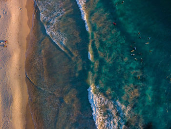 High angle view of surf on beach