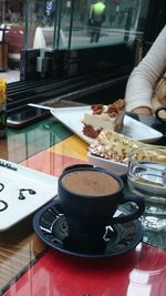 Close-up of coffee cup on table