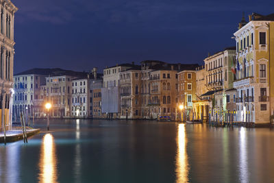 Reflection of buildings in city at night