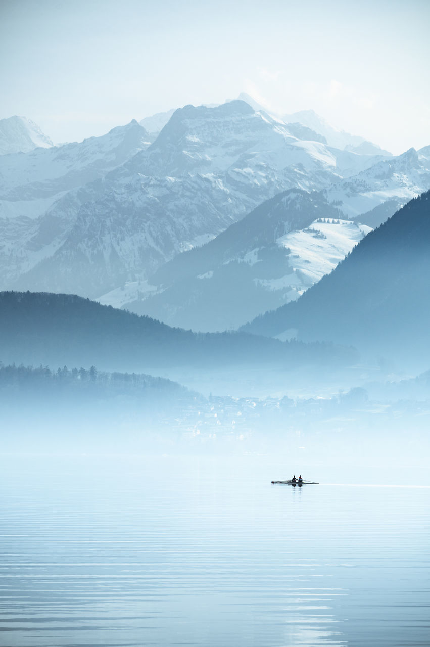 scenics - nature, beauty in nature, mountain, fog, tranquil scene, tranquility, non-urban scene, mountain range, sky, water, waterfront, idyllic, nature, cold temperature, day, no people, lake, winter, outdoors, snowcapped mountain, hazy