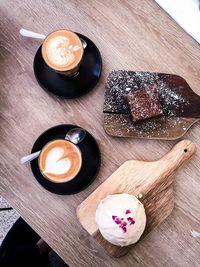 High angle view of coffee and dessert on table