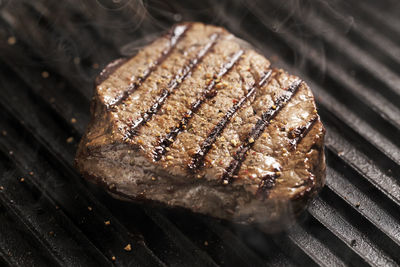 High angle view of meat on barbecue grill