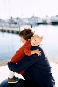 Father and daughter near sea