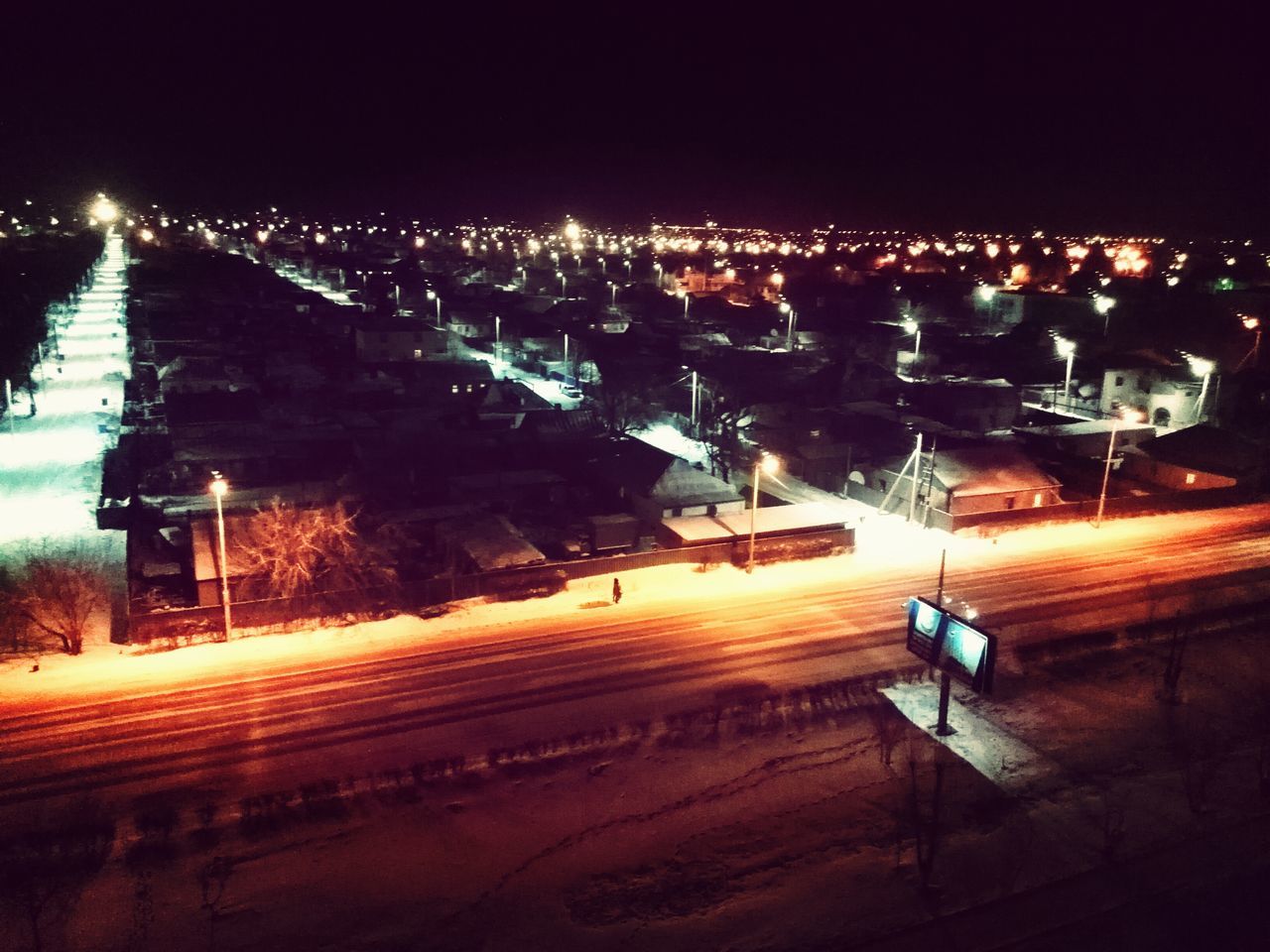 night, building exterior, illuminated, architecture, built structure, house, residential structure, high angle view, residential building, city, cityscape, residential district, town, clear sky, roof, outdoors, lighting equipment, townscape, sky, no people