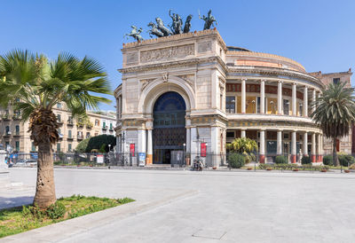 Teatro politeama palermo, politeama theatre front view from the side in daylight.