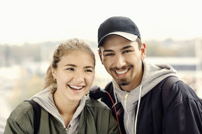 Portrait of happy young couple outdoors