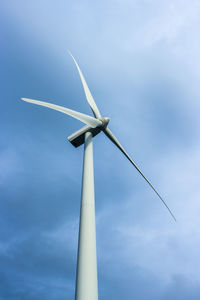 Low angle view of wind turbine against sky