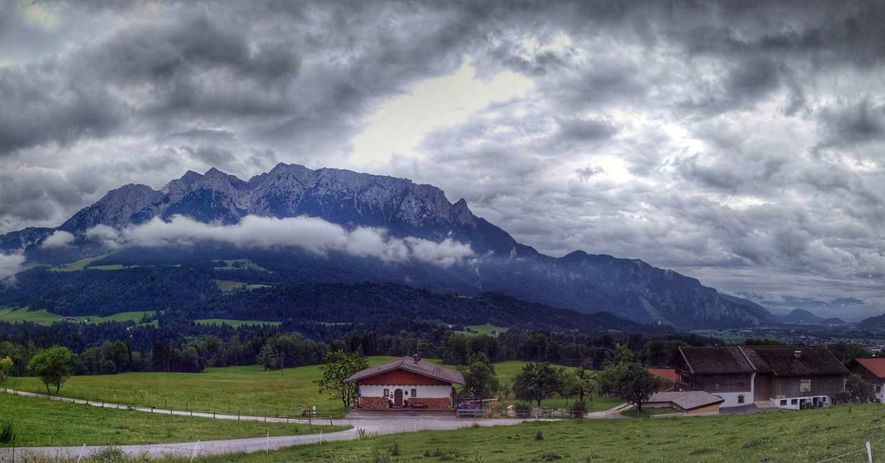 HOUSES AGAINST MOUNTAINS