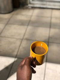 Midsection of person holding drink