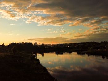 Scenic view of lake against sky during sunset