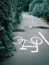 High angle view of arrow sign on road