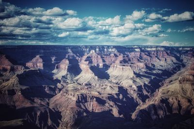 Aerial view of rock formations against sky