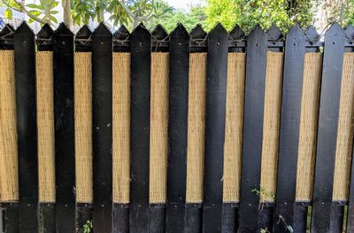 Close-up of wooden fence against plants