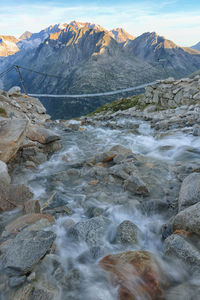 Scenic view of lake and mountains against sky