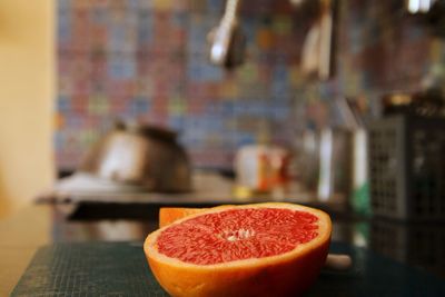 Close-up of grapefruit on table at home