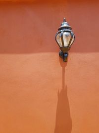 Close-up of electric lamp on wall