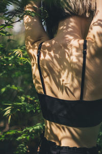 Rear view of woman standing outdoors