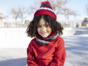 Portrait of a smiling girl in snow