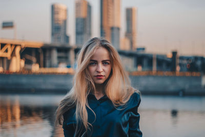 Portrait of beautiful young woman in city