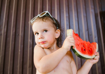 Portrait of boy eating food