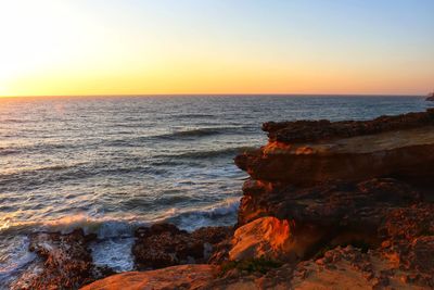 Scenic view of sea against sky during sunset