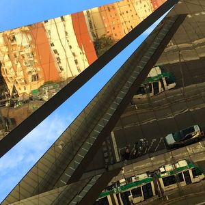 People in city against sky