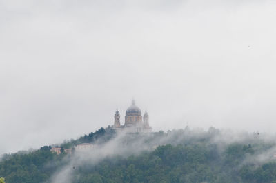 View of temple in foggy weather