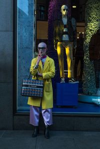 Full length of man standing in store