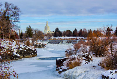 Scenic view of frozen lake against sky