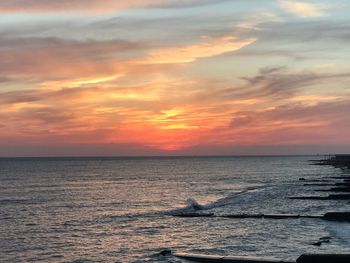 Scenic view of sea against sky during sunset