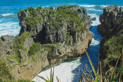 High angle view of rock formation in sea