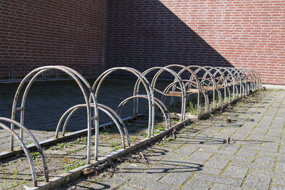 Metallic structure against brick wall