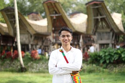 Portrait of smiling young man standing outdoors