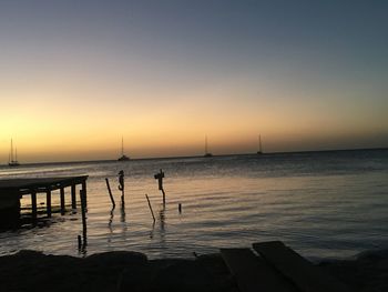 Scenic view of sea against clear sky during sunset