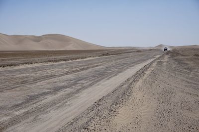 Scenic view of desert against clear sky