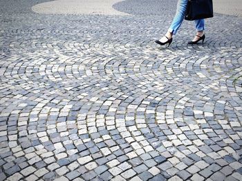 Low section of people walking on footpath